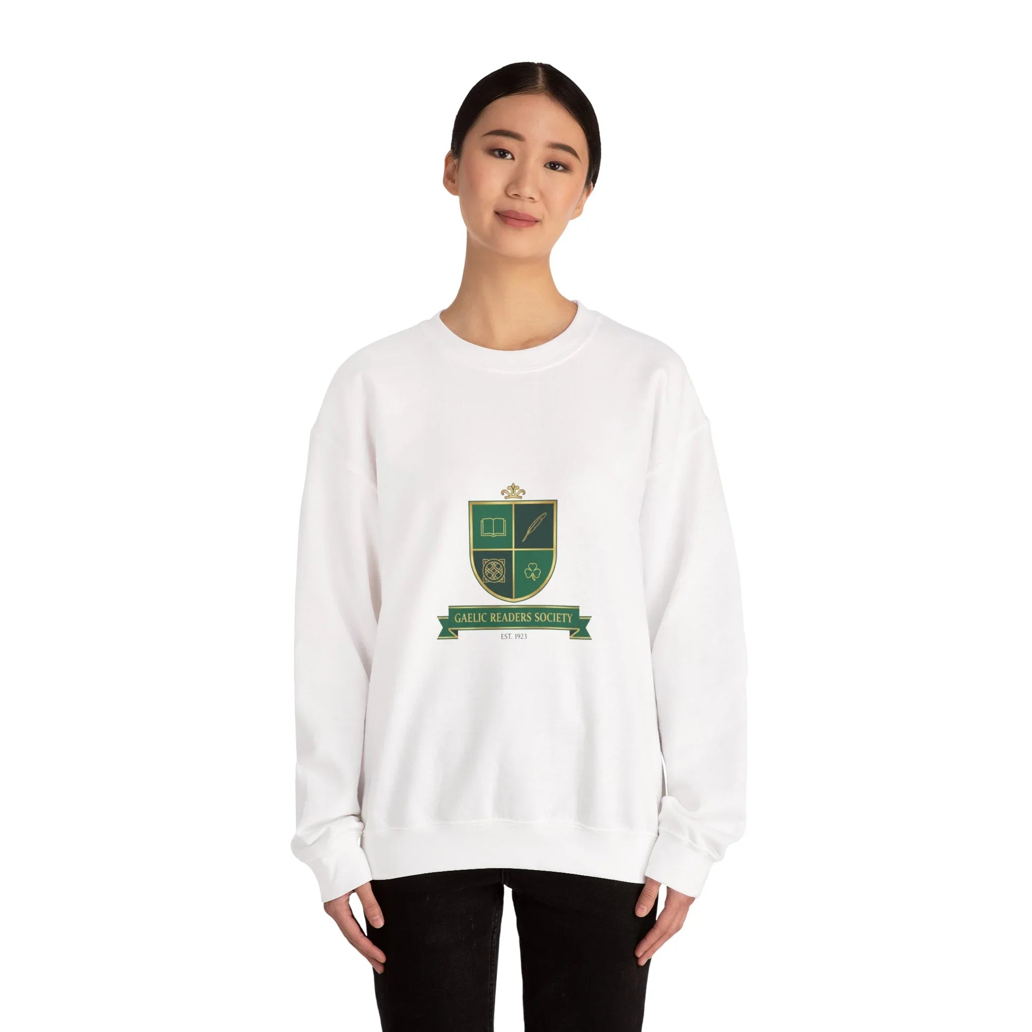 Woman wearing a white sweatshirt with green Gaelic Readers Society crest graphic